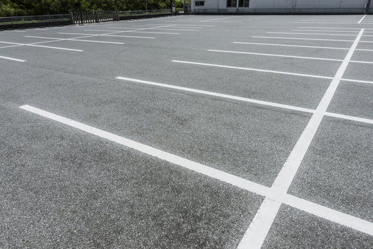 Car Parking lot with parking barrier, Vacant Parking Lot, Parking lane painting on floor, copy space
