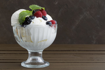 Ice cream balls in a glass vase.