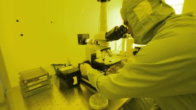 Scientists Working In A Microscope Microsystems Cleanroom Facility