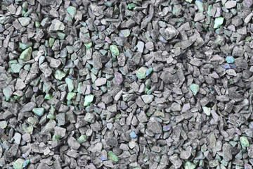 Grey gravel pile closeup photo for background. Grey stones bunch for wallpaper or banner template.