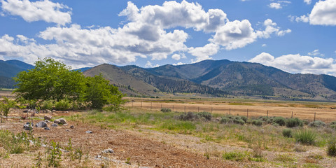 Fototapeta na wymiar panorama of ranchland and the mountains northwest of Weed and Edgewood including Klamath National Forest and Marble Mountain Wilderness near Mt Shasta in California