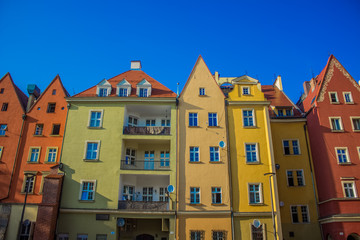 soft focus architecture concept of old city street small colorful houses facade in bright summer day time