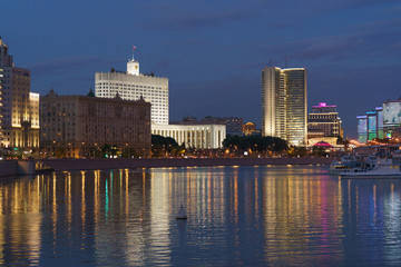 city buildings made of glass and metal at night time