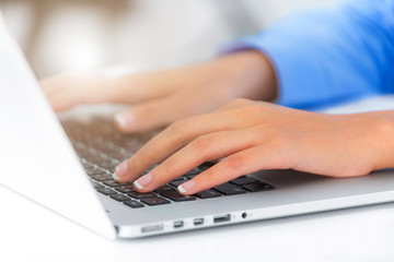 Close up businesswoman hands typing on laptop keyboard at the office, Woman worker  Business and finance concepts.
