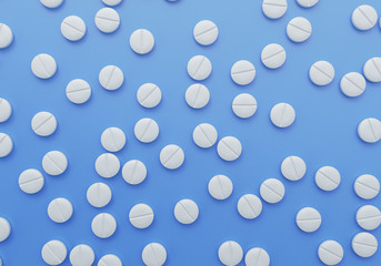 Scattered pills blue background