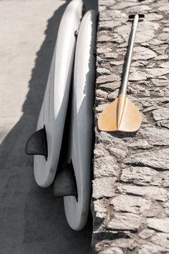 Pair of single stand up paddle in a row