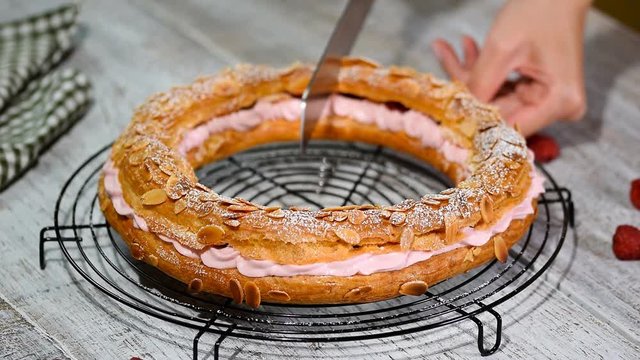 Homemade choux pastry cake Paris Brest with raspberries. French dessert.