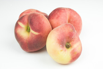A group of whole nectarine fruits isolated on a white background. useful fruit. seasonal fruits.