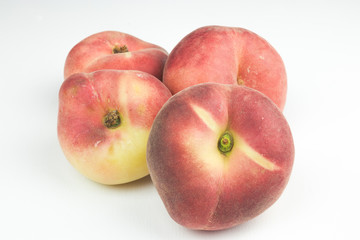 A group of whole nectarine fruits isolated on a white background. useful fruit. seasonal fruits.