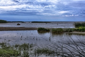water bay with grass and sand