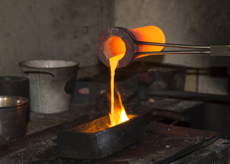 gold casting - pouring liquid gold