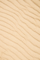 Sand of a beach with wave patterns