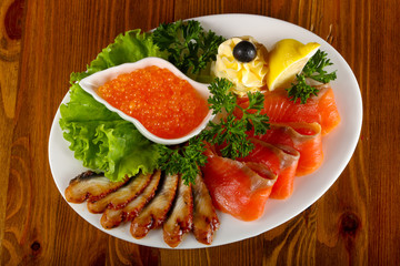 Trout fillet, red caviar and eel