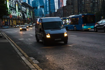 Minibus moving along the avenue