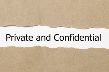 The word Private and confidential appearing behind torn paper.