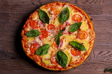 Pizza with ham and potato