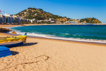 Fototapeta na wymiar Sea landscape in Blanes, Catalonia, Spain near of Barcelona. Scenic town with nice sand beach and clear blue water in beautiful bay. Famous tourist resort destination in Costa Brava
