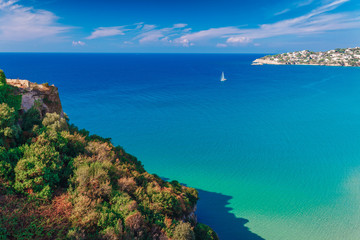 Fototapeta na wymiar Panoramic sea landscape with Gaeta, Lazio, Italy. Scenic historical town with old buildings, ancient churches, nice sand beach and clear blue water. Famous tourist destination in Riviera de Ulisse