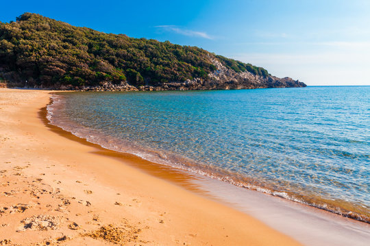 Panoramic sea beach landscape near Gaeta, Lazio, Italy. Nice sand beach and clear blue water. Famous tourist destination in Riviera de Ulisse. Bright sunny light and sunset.