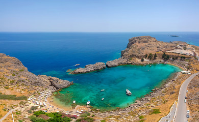 Aerial birds eye view drone photo Saint Paul bay near village Lindos, Rhodes island, Dodecanese, Greece. Sunny panorama with lagoon and clear blue water. Famous tourist destination in South Europe