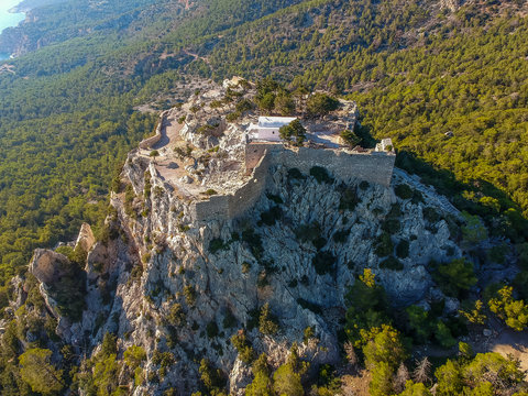 Aerial birds eye view drone photo ruins of Monolithos castle on Rhodes island, Dodecanese, Greece. Panorama with high mountain landscape. Famous tourist destination in South Europe