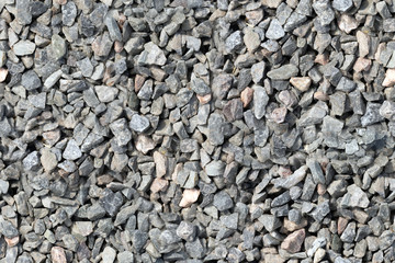 Grey gravel pile closeup photo for background. Grey stones bunch for wallpaper or banner template.