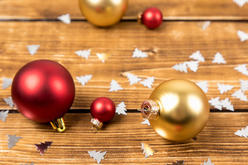 christmas balls red and gold wooden background