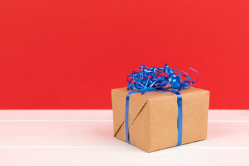 present with blue ribbon on red background