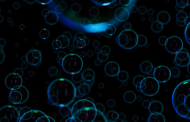Soap bubbles isolated on black background. Rainbow soap bubble. Bright green and orande colors. 