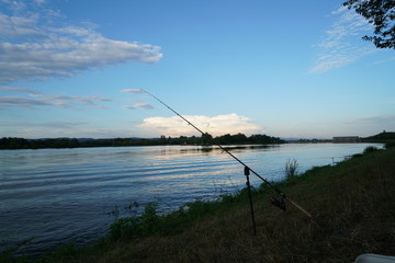 Fishing in Germany on a warm summer evening on the Danube 
