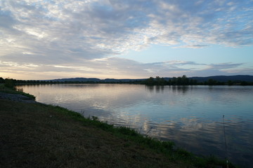 Fototapeta na wymiar Fishing in Germany on a warm summer evening on the Danube 