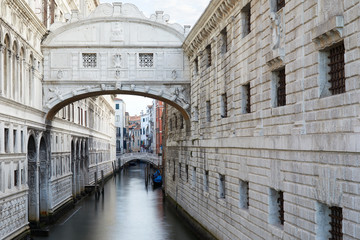 Bridge of Sighs in the early morning, calm water in Venice, Italy