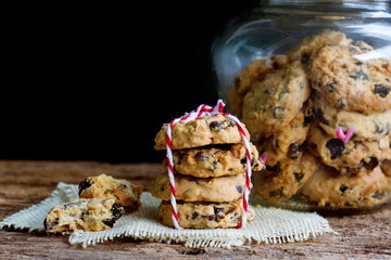 Pile of chocolate chip cookies on sackcloth.