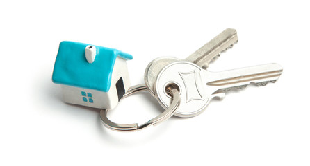 Keys and home key ring isolated on white background. Concept of buying a house, renting, mortgage