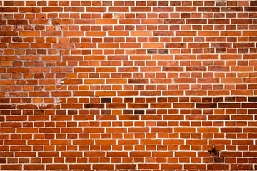Blocks in a line background. Cracked red brick wall