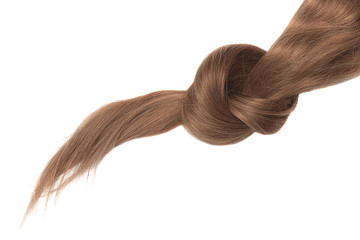 Knot of brown hair on white background