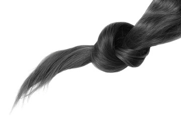 Knot of black hair on white background