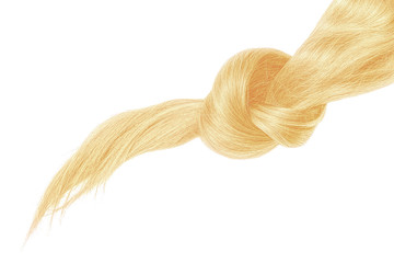 Knot of blond hair on white background