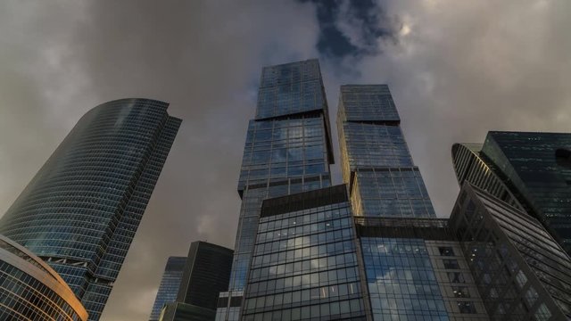 bottom-up view of rotating skyscrapers and flying clouds,time lapse, hyper lapse