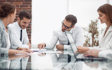 businessman talking with employees at a business meeting