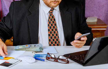 Man in suit counting business counting the American US dollars banknote money for business...