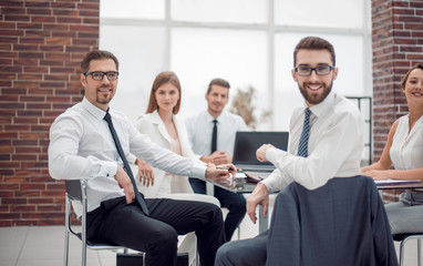Obraz na płótnie Canvas Manager and business team sitting at their Desk