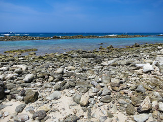 Fototapeta na wymiar View of the Caribbean Sea across the rocks from Baby Beach in Aruba