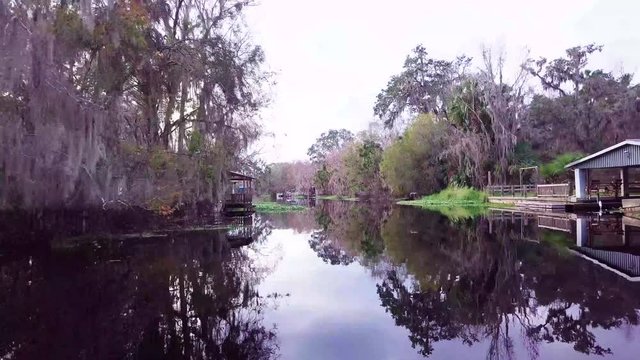 Flying low on a canal in a neighborhood in Florida
