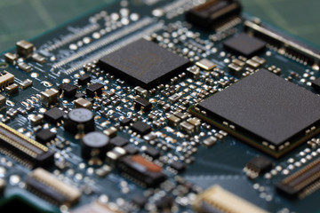 Electronics background technology close up of the green kit circuit board. Application Specific...