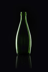 green soda bottle on the black