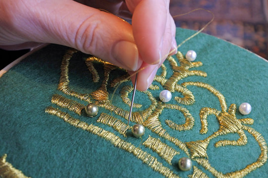 Woman embroidery at home