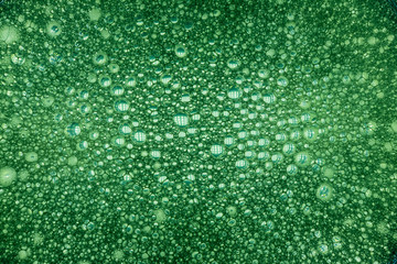 background. defocusing. soapy foam is illuminated with green light
