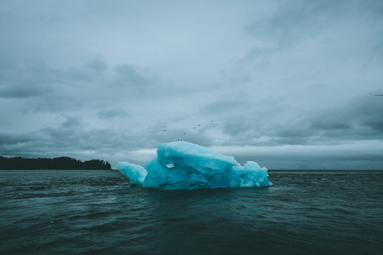 Ominous Iceberg in Dark Stormy Water