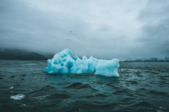 Ominous Iceberg in Dark Sea Water